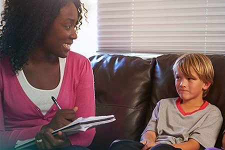 social worker meeting with boy