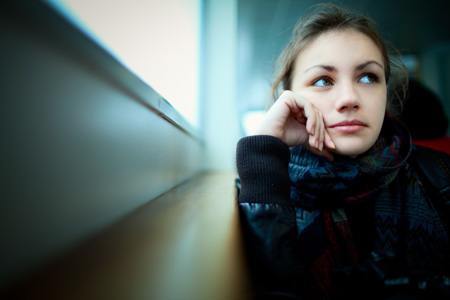 woman sitting by window