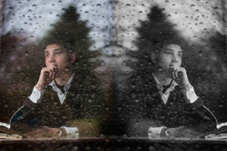 mirror image of pensive man