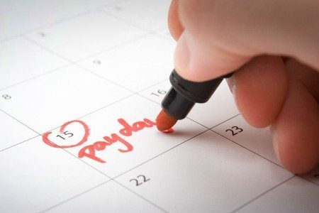 person writing on calendar
