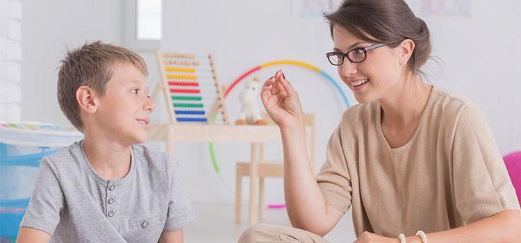 woman child psychologist and boy patient