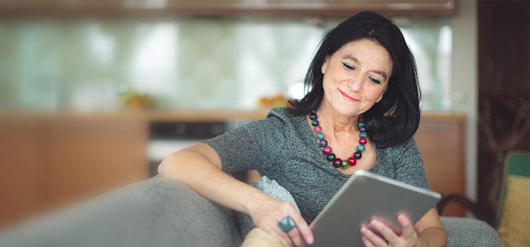 woman looking at electronic notepad