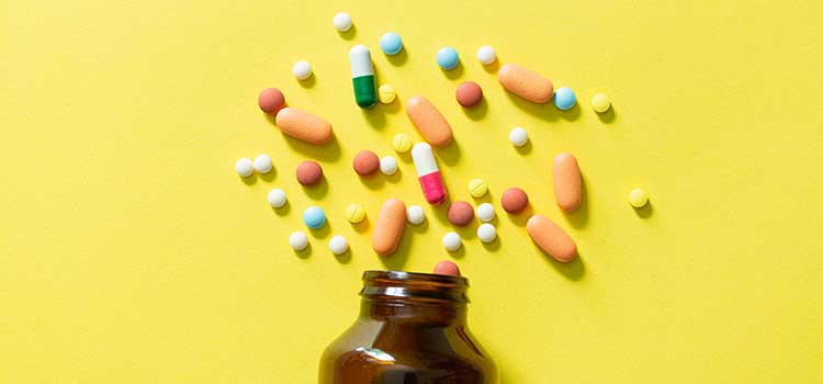 assortment of drugs from brown bottle