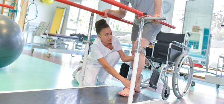 a female occupational therapist assisting a patient