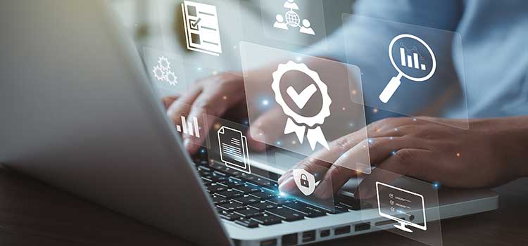 laptop and hand with professional certification logo