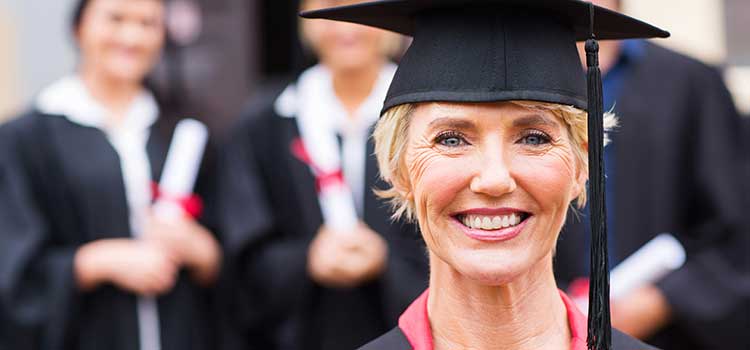 woman goes back to school and gets bachelors degree at graduation