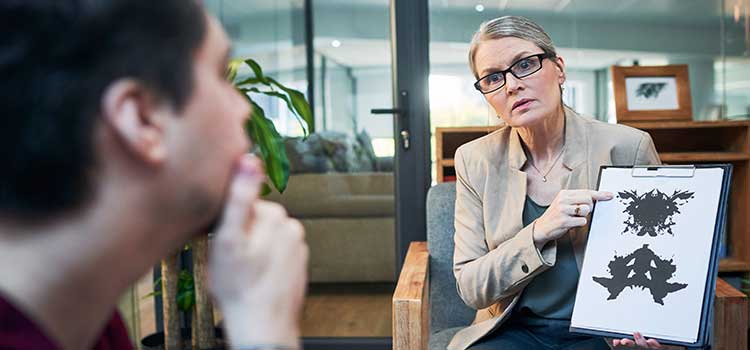 psychometrist works with patient to give rorshach test